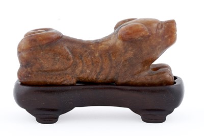 Lot 826 - A small rust coloured jade dog