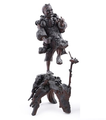 Lot 168 - A carved root wood figure