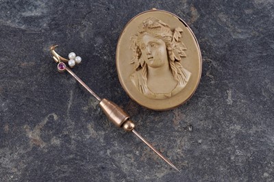 Lot 19 - A Victorian lava cameo brooch set in 9ct rose gold; and a 15ct gold and seed pearl stick pin