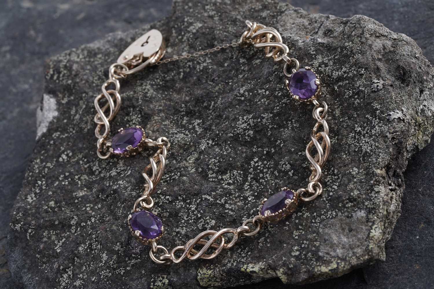 Lot 18 - An edwardian style amethyst and 9ct gold bracelet