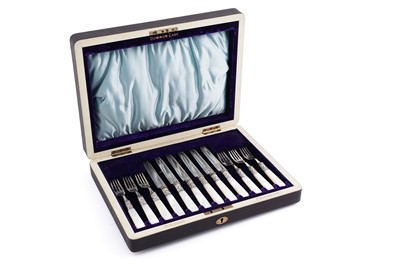 Lot 295 - An Edwardian canteen of mother of pearl handled fruit knives and forks, six knives and forks