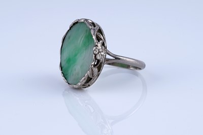 Lot 21 - A 1920s Chinese jade and silver ring