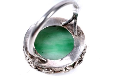 Lot 21 - A 1920s Chinese jade and silver ring