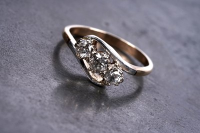 Lot 65 - A three-stone twist-set diamond ring