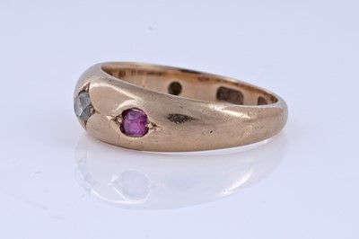 Lot 5 - A Victorian ruby and diamond gypsy-set three-stone ring on 18ct gold | dated 1893