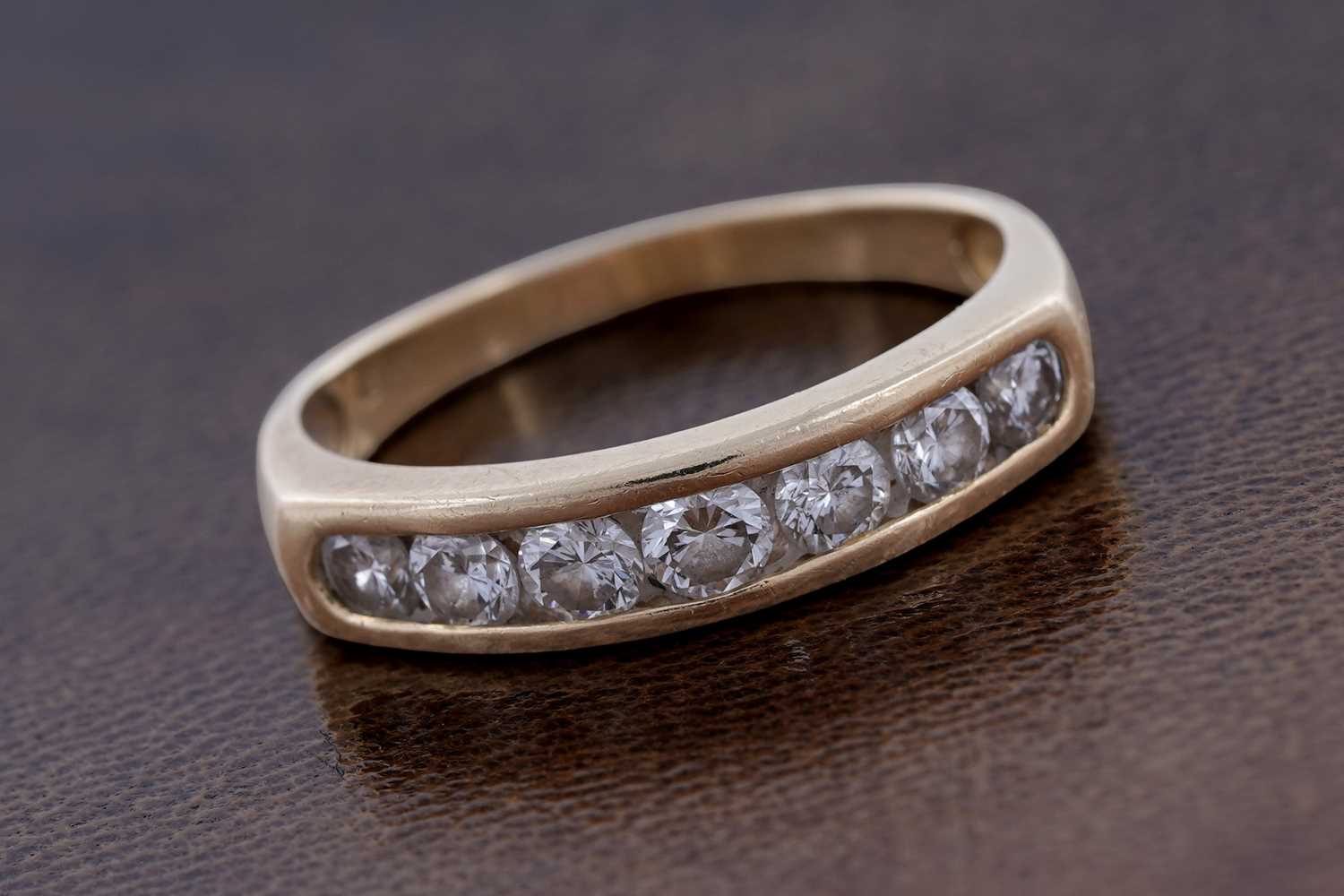Lot 51 - A contemporary seven-stone diamond eternity ring