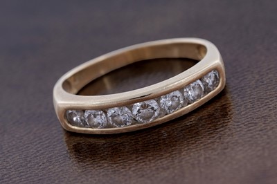 Lot 51 - A contemporary seven-stone diamond eternity ring