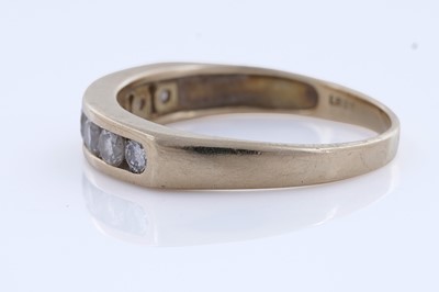 Lot 51 - A contemporary seven-stone diamond eternity ring