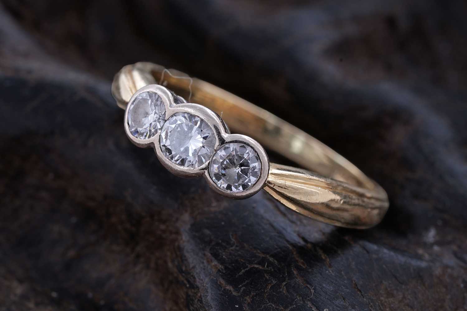 Lot 56 - A contemporary three-stone diamond ring
