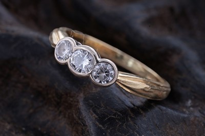 Lot 56 - A contemporary three-stone diamond ring