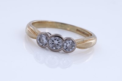 Lot 56 - A contemporary three-stone diamond ring