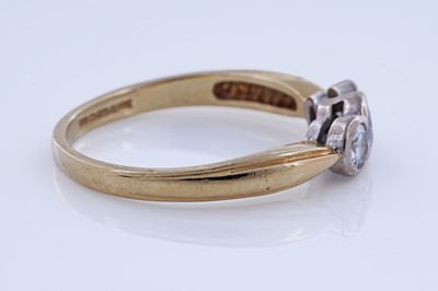 Lot 56 - A contemporary three-stone diamond ring
