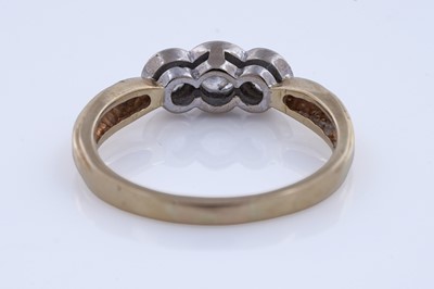 Lot 56 - A contemporary three-stone diamond ring