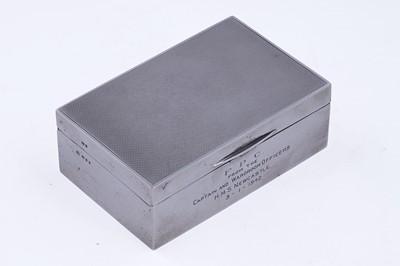 Lot 402 - A George VI silver table cigarette box of Second World War HMS Newcastle interest