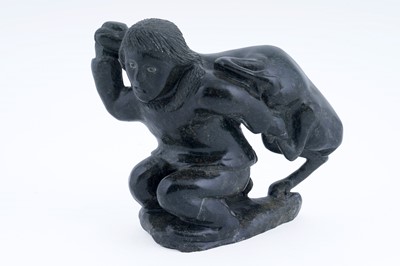 Lot 220 - A carved Inuit soapstone figure