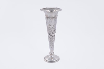 Lot 412 - An Edwardian silver trumpet-form vase relief-decorated with lilies