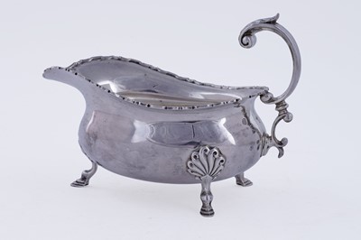 Lot 418 - A George V silver sauce boat