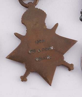 Lot 6 - WWI medals; and photographic postcards