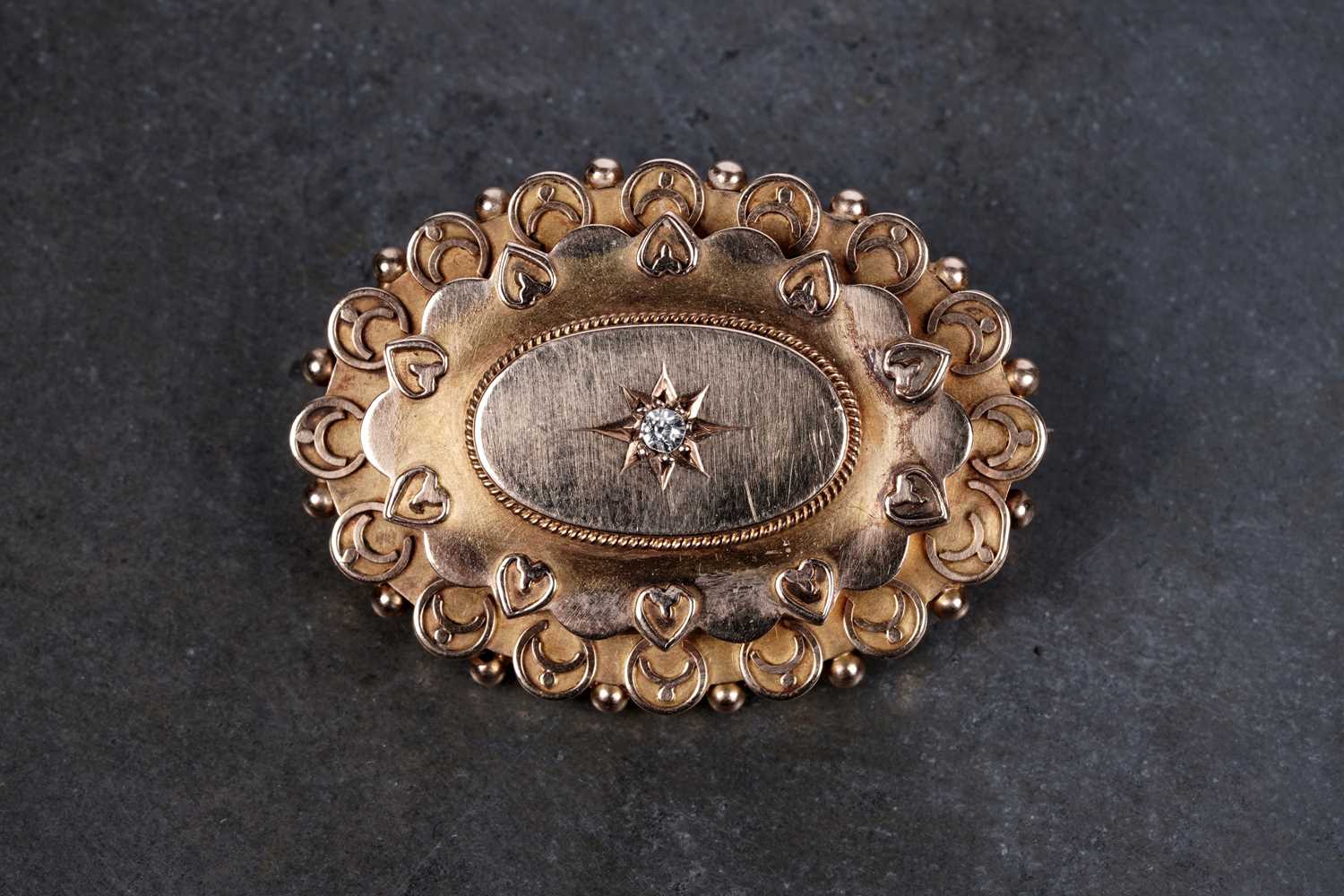Lot 2 - A Victorian Etruscan Revival diamond brooch on 15ct gold