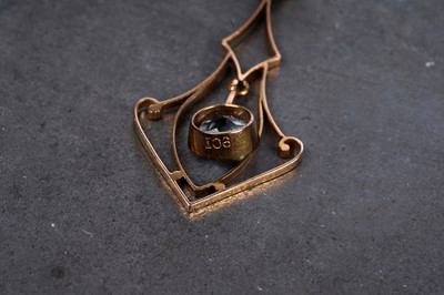 Lot 26 - An Edwardian Art Nouveau aquamarine pendant