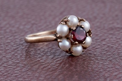 Lot 293 - A garnet and half cultured-pearl cluster ring