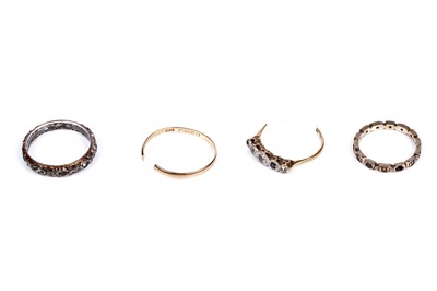 Lot 116 - Four rings including: two eternity rings