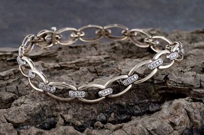 Lot 296 - A 9ct yellow gold and diamond bracelet