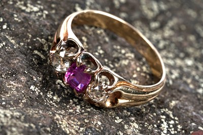 Lot 37 - An Edwardian pink sapphire and diamond three-stone ring