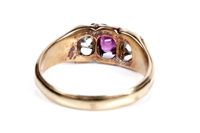 Lot 37 - An Edwardian pink sapphire and diamond three-stone ring