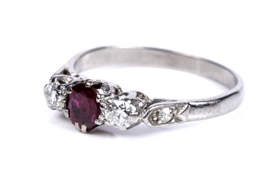 Lot 42 - An early 20th Century Art Deco influenced ruby and diamond three-stone ring