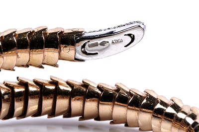 Lot 923 - Roberto Coin: a Snake Collection diamond and gold torque bracelet