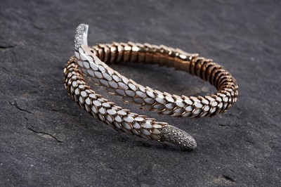 Lot 923 - Roberto Coin: a Snake Collection diamond and gold torque bracelet