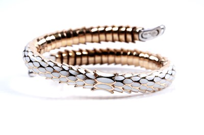 Lot 923 - Roberto Coin: a Snake Collection diamond and gold torque bracelet