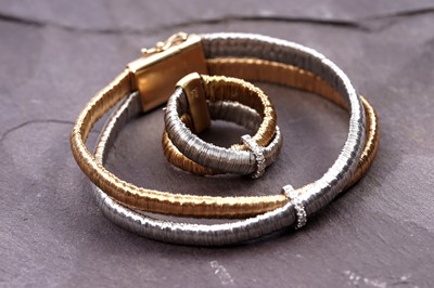 Lot 924 - Yvel: an 18ct white and yellow gold and diamond set bracelet and ring set