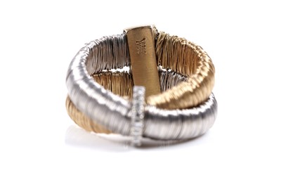 Lot 924 - Yvel: an 18ct white and yellow gold and diamond set bracelet and ring set