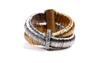 Lot 924 - Yvel: an 18ct white and yellow gold and diamond set bracelet and ring set