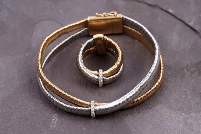 Lot 924 - Yvel: an 18ct white and yellow gold and diamond set bracelet and ring set
