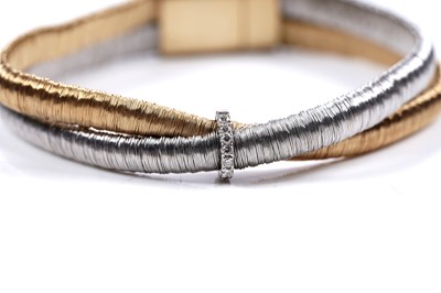 Lot 924 - Yvel: an 18ct white and yellow gold and diamond set bracelet and ring set