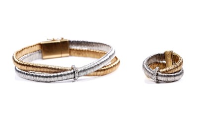 Lot 924 - Yvel: an 18ct white and yellow gold and diamond set bracelet and ring set