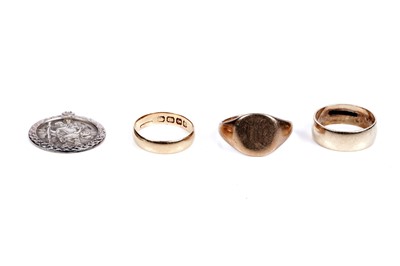 Lot 112 - Three gold rings; and a silver St Christopher pendant