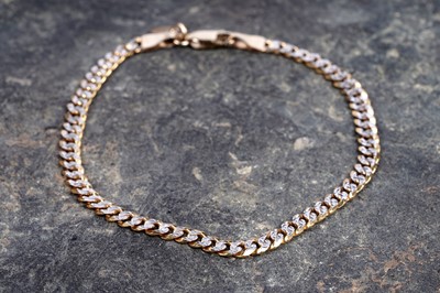 Lot 127 - A 9ct yellow and white gold bracelet