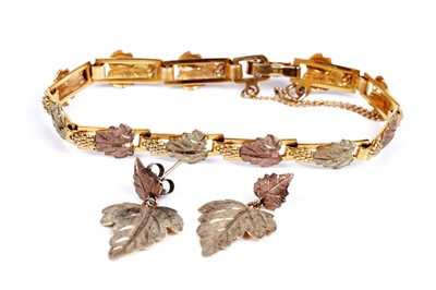 Lot 188 - A 9ct yellow and rose gold bracelet; and earrings