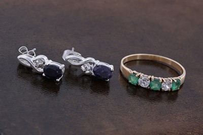 Lot 93 - An emerald ring on 18ct gold, and a pair of sapphire stud earrings