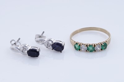 Lot 93 - An emerald ring on 18ct gold, and a pair of sapphire stud earrings