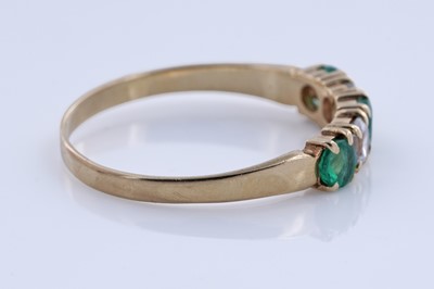 Lot 93 - An emerald ring on 18ct gold, and a pair of sapphire stud earrings