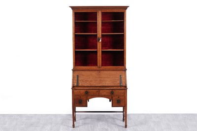 Lot 103 - An early 20th Century Arts & Crafts oak bureau bookcase