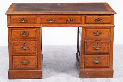 Lot 87 - An early 20th Century oak pedestal writing desk