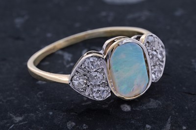Lot 61 - An Edwardian Art Nouveau opal and diamond ring
