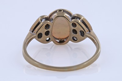 Lot 61 - An Edwardian Art Nouveau opal and diamond ring