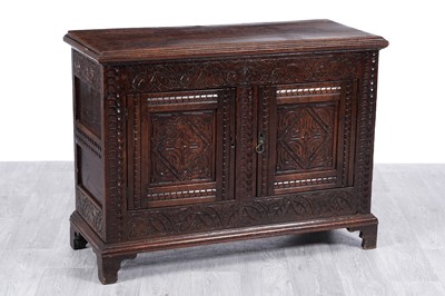 Lot 107 - A 19th Century carved oak cabinet